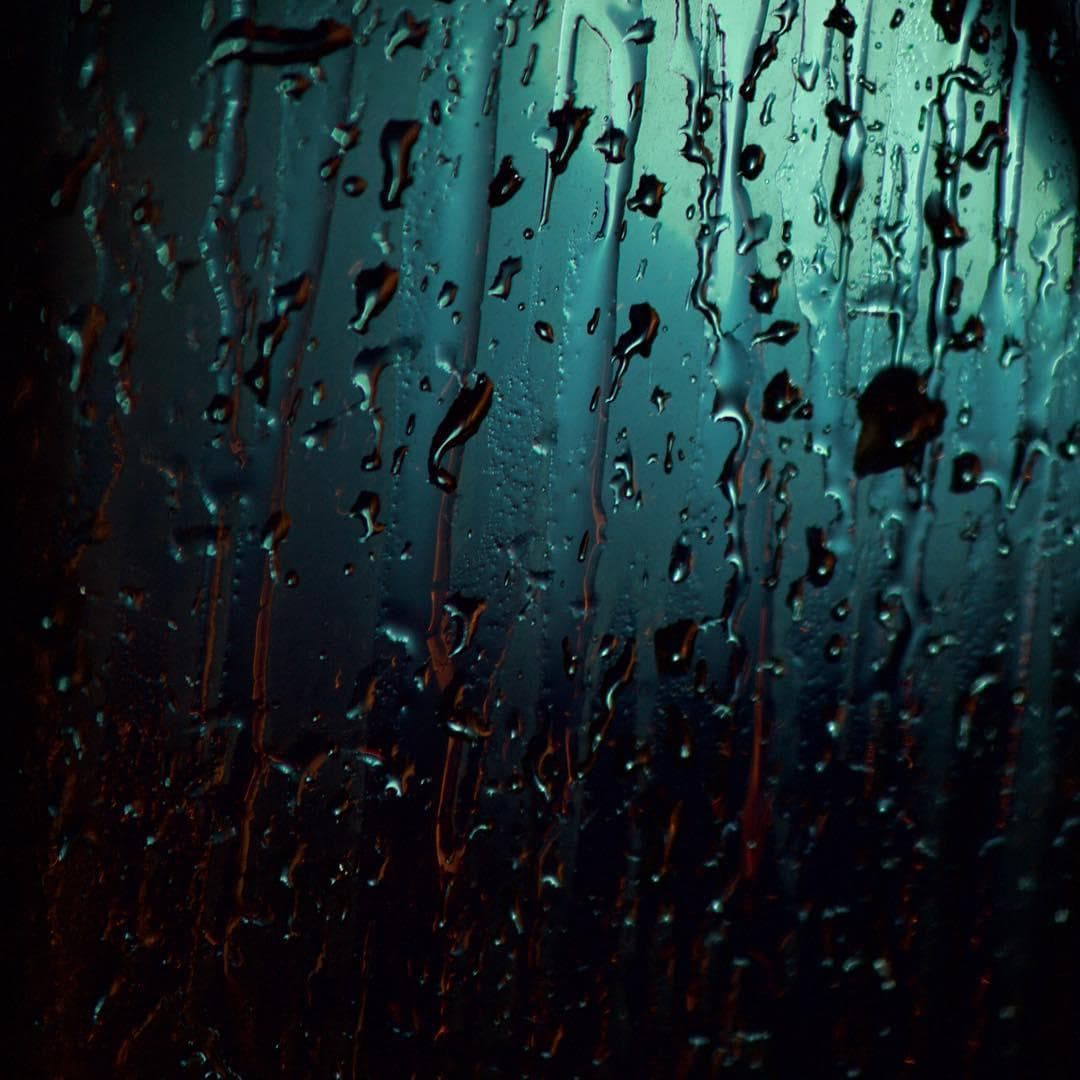 Close up shot of drops in rain at night